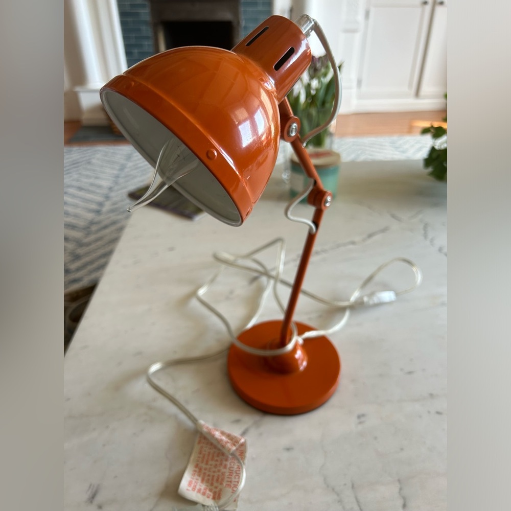 Orange desk lamp with 2 adjustable points